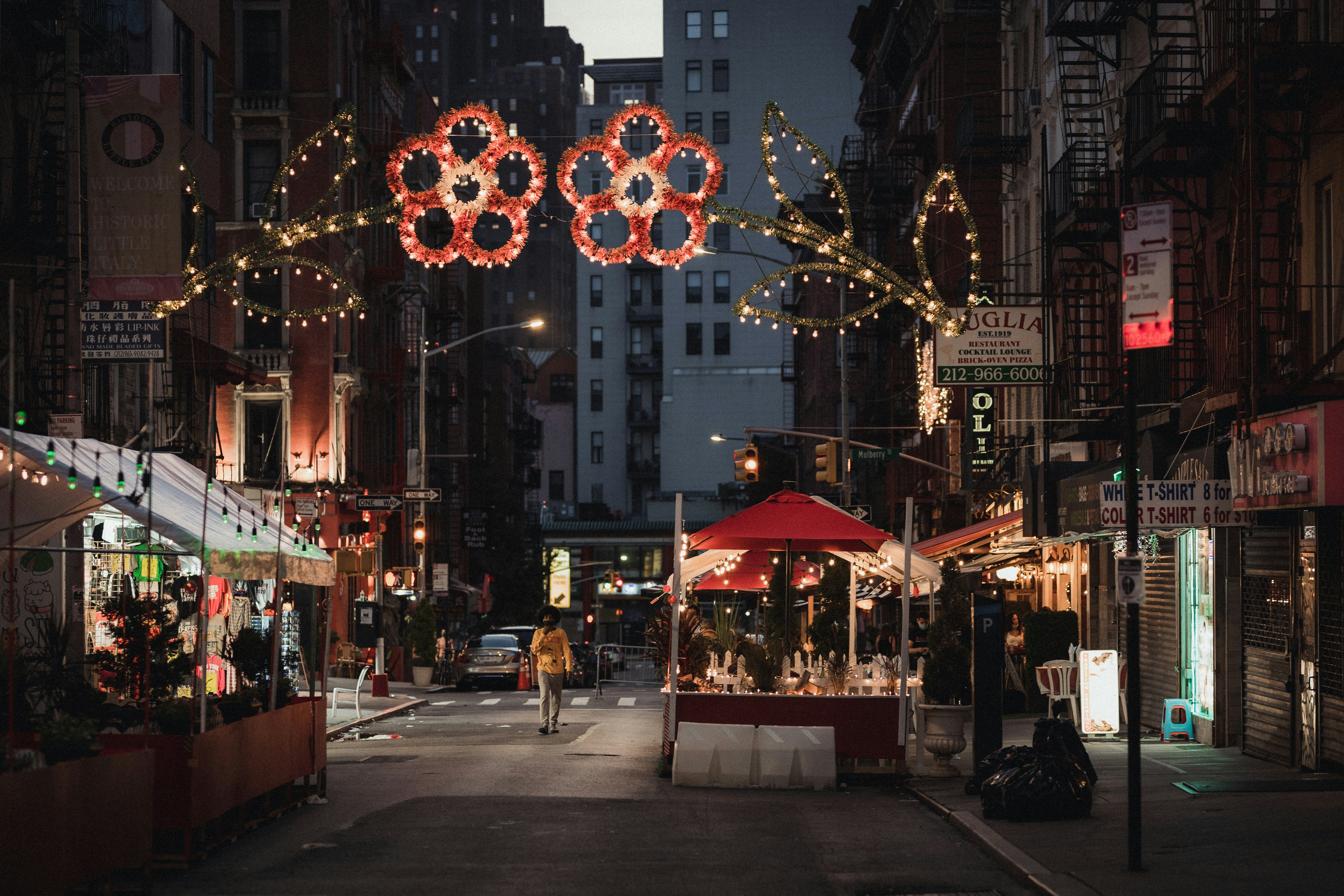 people walking on street during night time